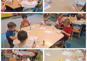 Dzieci przy stolikach wykonują piramidę żywieniową jako pracę plastyczną.